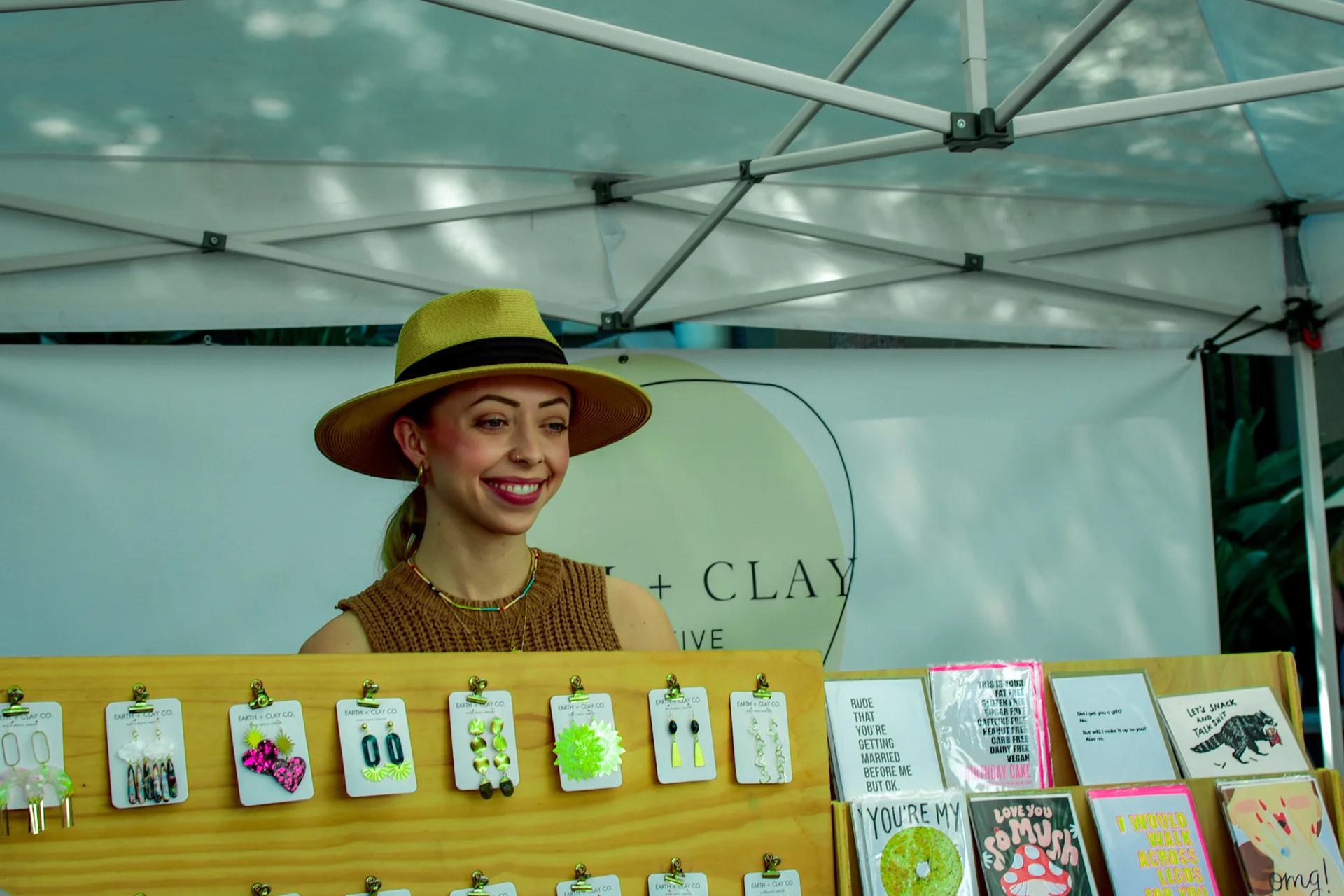 market_stall_earring_saleswoman.webp
