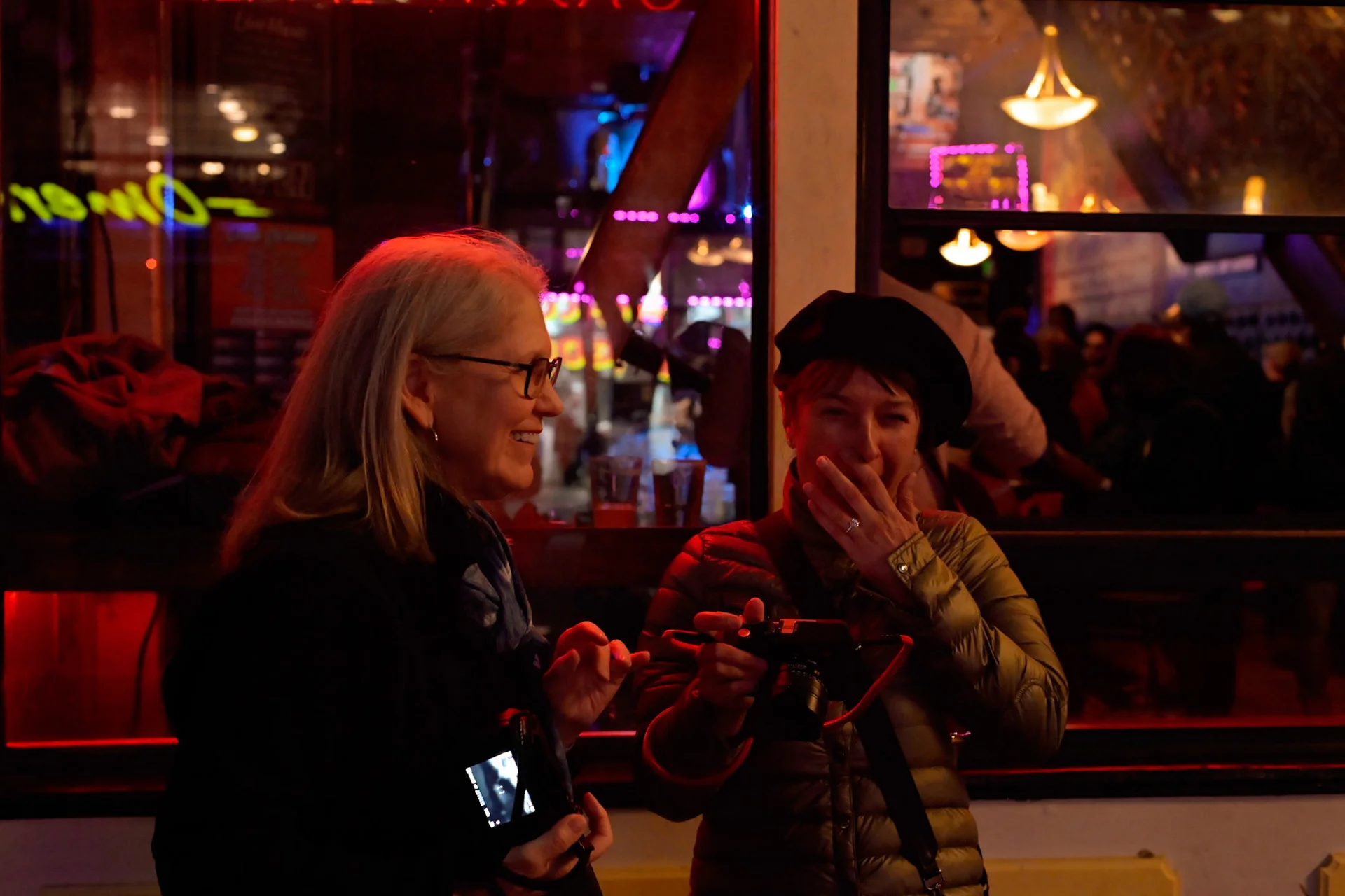 nighttime_photographers_outside_restaurant.webp